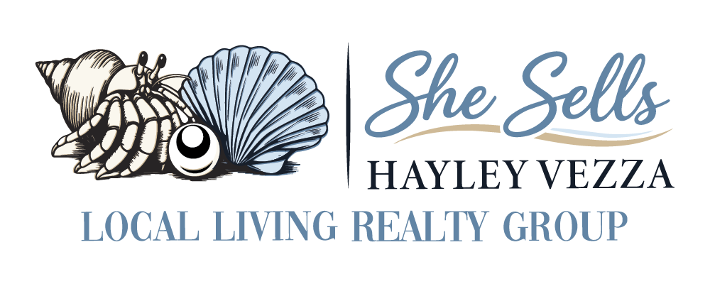 She Sells logo: hermit crab, seashells, pearl, and "Local Living Realty Group" text.