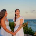 Hayley Vezza and daughter on beach at sunset, local living real estate
