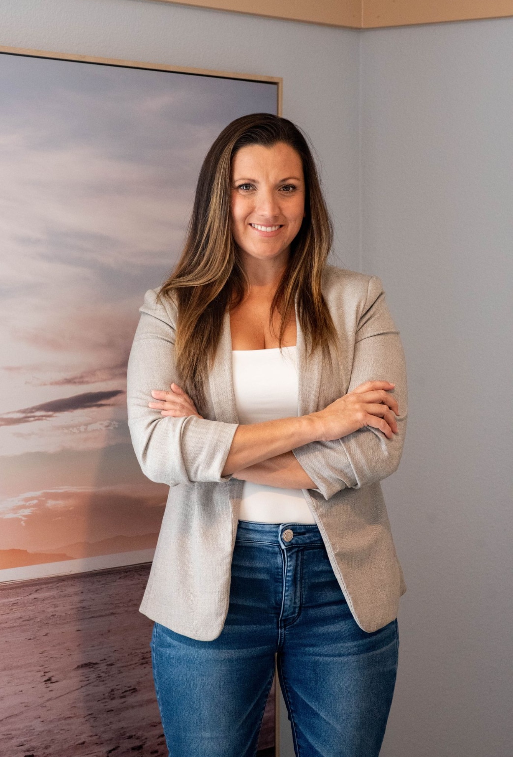 Hayley Vezza of Local Living Real Estate standing with arms crossed