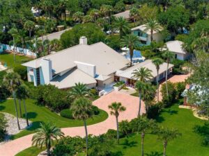 Aerial view of 1006 S Riverside Drive Edgewater FL luxury home with pool