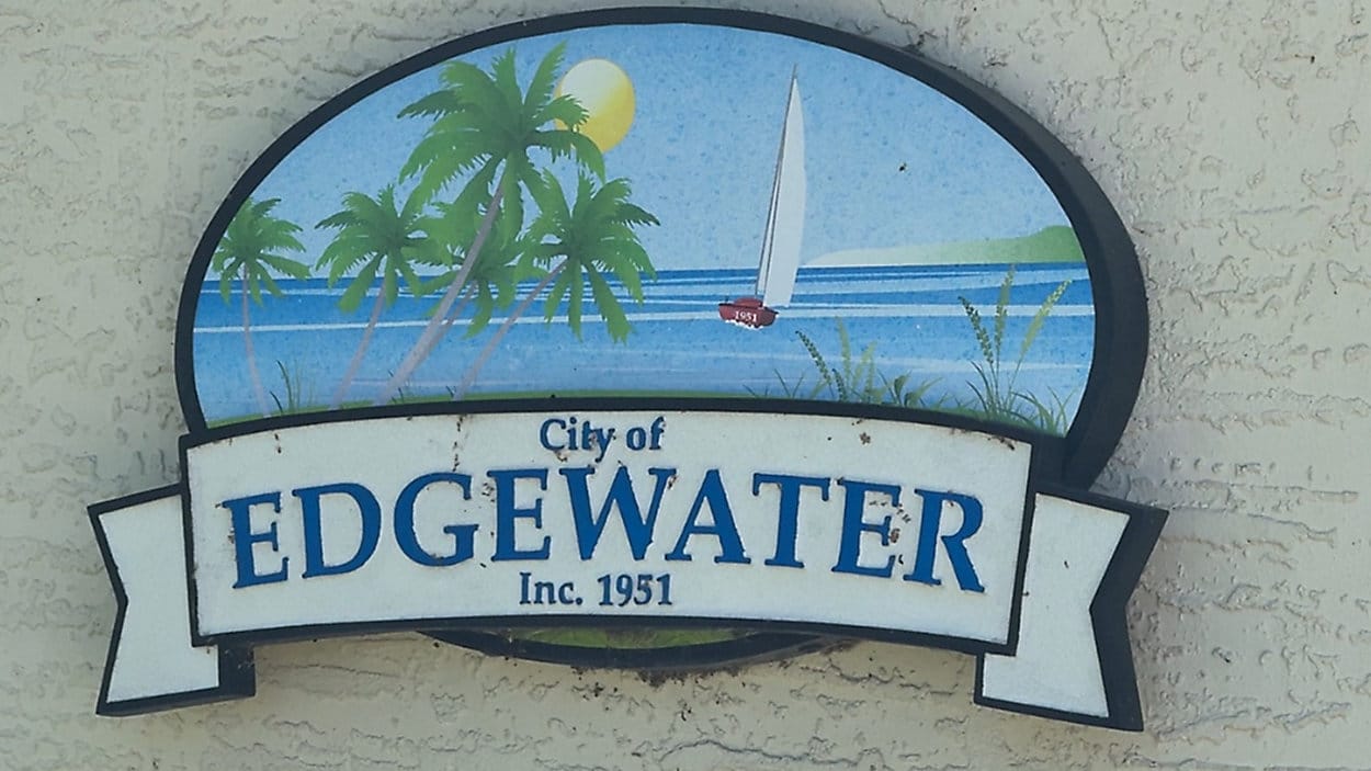 City of Edgewater Inc. 1951 sign with palm trees and sailboat