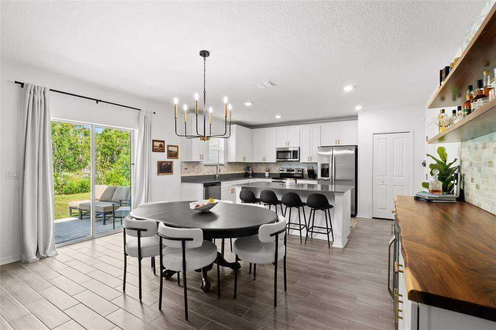Open-plan kitchen and dining area at 2516 Hoptree Ln, Edgewater, FL