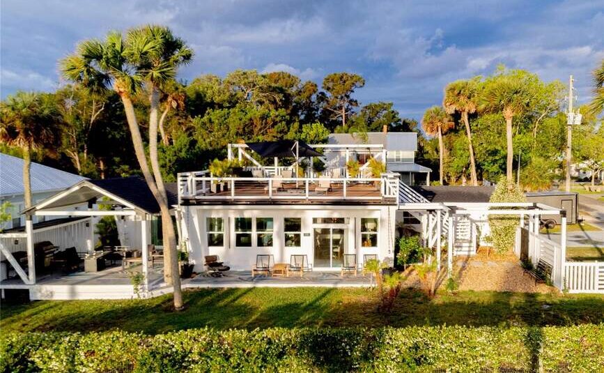 Modern white home with rooftop deck at 500 S Riverside Dr, Edgewater, FL